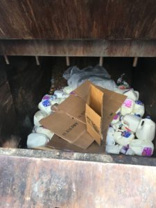 Gallons and gallons of milk in the dumpster. I don't appreciate this at all.